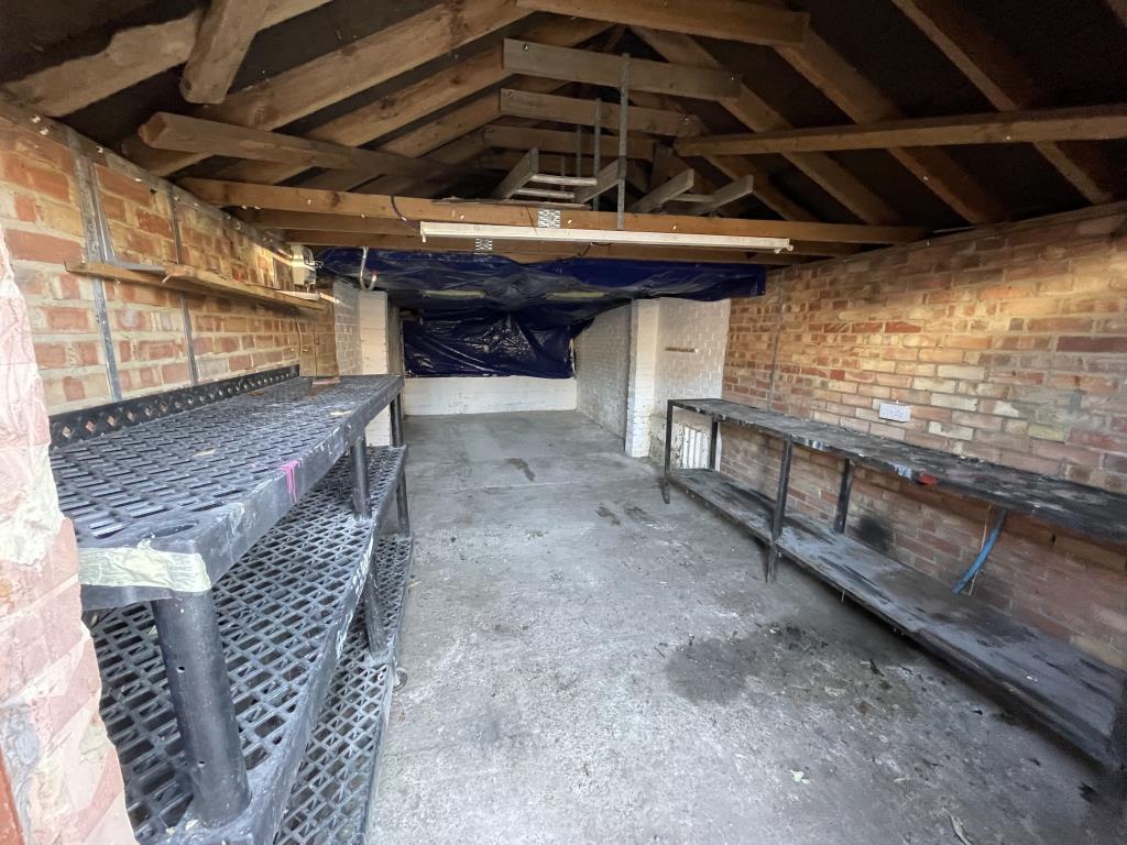 Lot: 53 - GATED STORAGE AND WORKSHOP YARD WITH POTENTIAL - Inside view of garage 1